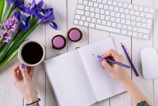 writer and notebook - deposit photos